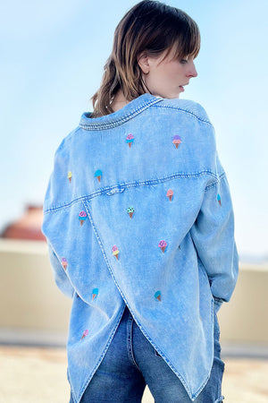 Billy T Ice Cream Embroidered Shirt in Denim with multi colored embroidered ice cream cones. Pointed collar button down with long sleeves with button cuffs. Dropped shoulder. Roll button tab on sleeve. Back yoke with back vent. Relaxed fit._34273367654600
