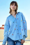 Billy T Ice Cream Embroidered Shirt in Denim with multi colored embroidered ice cream cones.  Pointed collar button down with long sleeves with button cuffs.  Dropped shoulder.  Roll button tab on sleeve.  Back yoke with back vent.  Relaxed fit._t_34273367621832