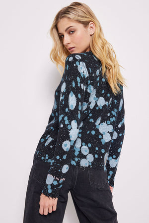 Lisa Todd Cosmic Crush Sweater in Black. Abstract dot print in shades of blue on a black background. Crew neck long sleeve sweater with rib trim at neck, hem and cuffs. Hand stitch details. Distressed edges at cuff and hem. Classic fit._34618749419720