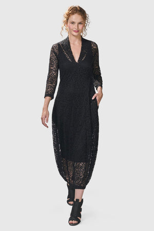 Alembika Artemis Cocoon Dress in black.  Crochet lace dress with black tank slip below.  V neck with high back.  3/4 sleeves  Balloon skirt. 2 in seam pockets.  Relaxed fit._34704023945416