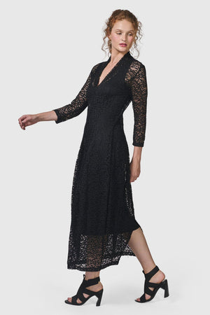 Alembika Artemis Cocoon Dress in black. Crochet lace dress with black tank slip below. V neck with high back. 3/4 sleeves Balloon skirt. 2 in seam pockets. Relaxed fit._34704024010952