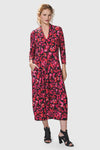 Alembika Begonia Cocoon Dress.  Pink and red petal print on a black background.  V neck midi dress with a high neck in back.  3/4 sleeve  Dropped waist.  Bubble skirt.  2 in seam pockets.  Relaxed fit._t_34703985508552