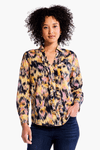 NIC+ZOE Dreamy Ruffle Shirt in Yellow Multi. Black, yellow and pink ikat inspired print. Pointed collar split v neck button down. Ruffle trim around button placket. Long sleeves with button cuffs. Back yoke. Shirt tail hem. Relaxed fit._t_34344705589448