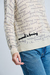 Lisa Todd Normal is Boring Cashmere Sweater in Winter White.  Crew neck long sleeve sweater with screen print "normal is boring" slogan throughout.  Embroidered slogan in black at lower right.  Rib trim at neck, hem and cuff.  Classic fit._t_61210145587566