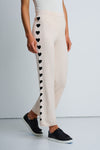 Lisa Todd Heart Track Pant in Sheepskin.  1 1/4" elastic waist pull on cotton/cashmere pant.  Black intarsia hearts down the side of each leg.  Straight leg.  Snug through stomach and hip, straight to hem. Rib trim at hem.  10 1/4" leg opening; 28" inseam._t_61429933015406