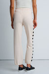 Lisa Todd Heart Track Pant in Sheepskin.  1 1/4" elastic waist pull on cotton/cashmere pant.  Black intarsia hearts down the side of each leg.  Straight leg.  Snug through stomach and hip, straight to hem. Rib trim at hem.  10 1/4" leg opening; 28" inseam._t_61429933048174