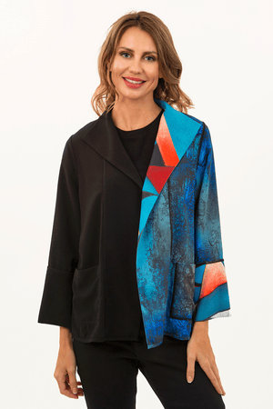 Lemon Grass Reversible Crepe Jacket in Turquoise. Turquoise and black print on the right side of front with solid black on the left. Reverses to a different print on the left side and solid black on the right._34446939259080