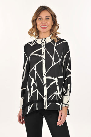 Lemon Grass Stand Collar Eyelet Trim Blouse in Black/Cream.  Black and cream abstract line print with reverse color trim.  Stand collar button down blouse with pairs of buttons.  Long sleeves with double button cuff.  Reverse print inset down center back.  Eyelet ribbon detail.  High low hem.  Side slits.  Relaxed fit._61407833686382