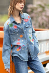 Billy T Festival Denim Shirt in Denim.  Classic denim mid weight shirt with bright multi colored embroidered appliques.  Pointed collar button down with 2 front button flap patch pockets.  Long sleeve with button cuff and roll button tab.  High low shirt tail hem.  Relaxed fit._t_34304929890504