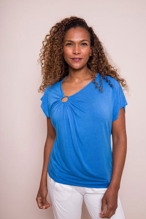 Suzy D Giana Tee with Metal Circle in Royal Blue.  Asymmetric v neck tee with metal ring detail.  Soft gathers around ring.  Dolman cap sleeve.  Relaxed fit._34225166450888