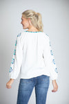 APNY Embroidered Top. Blue and turquoise embroidery on white cotton gauze. Crew neck with split v and tassel tie. Embroidered neck placket. Embroidered design on front and sleeves. Raglan 3/4 sleeve with elastic cuff. Curved hem with side slits. Relaxed fit._t_35228847440072