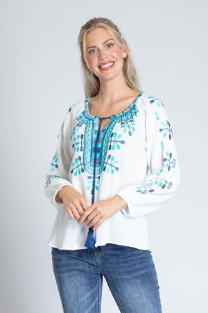 APNY Embroidered Top.  Blue and turquoise embroidery on white cotton gauze.  Crew neck with split v and tassel tie.  Embroidered neck placket.  Embroidered design on front and sleeves.  Raglan 3/4 sleeve with elastic cuff.  Curved hem with side slits.  Relaxed fit._35228847472840