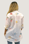 Kyla Seo Rachelle Shirt in White.  Embroidered hearts and flowers on lightweight cotton.  Pointed collar button down shirt.  Long sleeves with button cuff. Shirt tail hem.  Relaxed fit._t_59687816888686