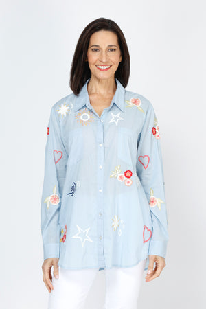 Kyla Seo Rachelle Shirt in Blue.  Embroidered hearts and flowers on lightweight cotton.  Pointed collar button down shirt.  Long sleeves with button cuff. Shirt tail hem.  Relaxed fit._59777706951022