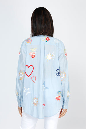 Kyla Seo Rachelle Shirt in Blue.  Embroidered hearts and flowers on lightweight cotton.  Pointed collar button down shirt.  Long sleeves with button cuff. Shirt tail hem.  Relaxed fit._59777706983790
