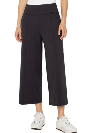 Liverpool Crop Wide Leg Tech Pant in Black.  Pull on pant with wide dropped waistband.  Center front seams.  Shaped seam at rear.  2 front slash pockets.  Wide leg.  22 1/2" inseam._61403690631534
