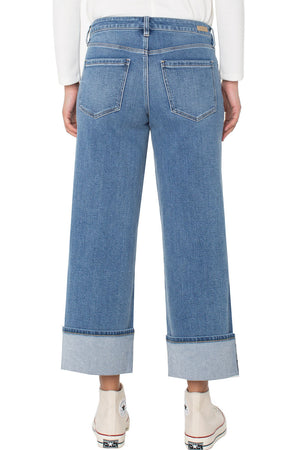 Liverpool Morgan Cuffed Wide Jean in Klamath, a mid-blue wash.  Mid rise jean with button and zip closure and 5 pocket styling.  Wide leg with wide cuff button.  Leg opening: 11".  Inseam: 27"_61497782534510