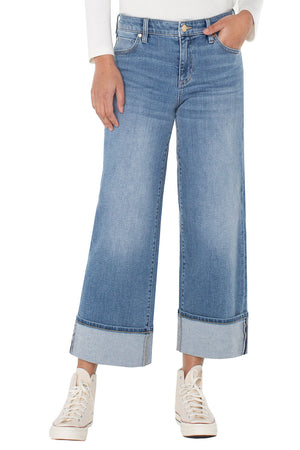 Liverpool Morgan Cuffed Wide Jean in Klamath, a mid-blue wash.  Mid rise jean with button and zip closure and 5 pocket styling.  Wide leg with wide cuff button.  Leg opening: 11".  Inseam: 27"_61497782501742