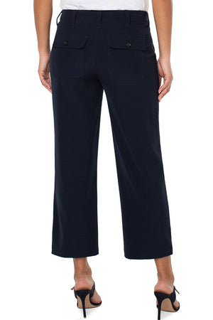 Liverpool Cargo Crop with Chain Trim in Lunar Blue a dark navy. Wide leg crop pant with button and zip closure. 2 large front pockets with stitch detail. 2 back flap cargo pockets. 26" inseam._34626792653000