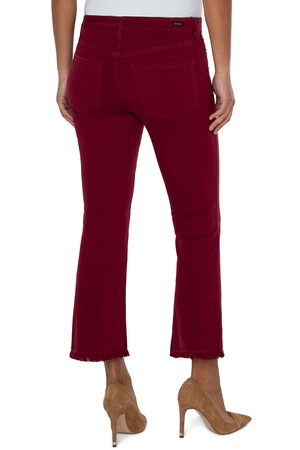 Liverpool Hannah Crop Flare in Red. Mid rise denim jean with button and zip closure. 5 pocket jean styling. Slim through thigh, flare below knee. Frayed hem. 27" inseam._34537484746952