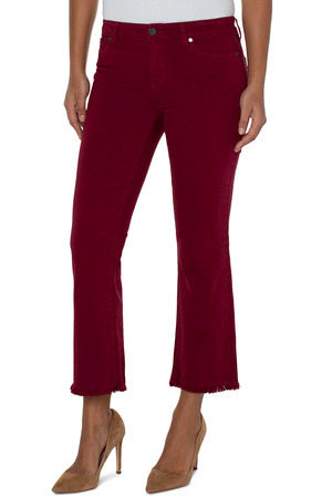 Liverpool Hannah Crop Flare in Red. Mid rise denim jean with button and zip closure. 5 pocket jean styling. Slim through thigh, flare below knee. Frayed hem. 27" inseam._34537484714184