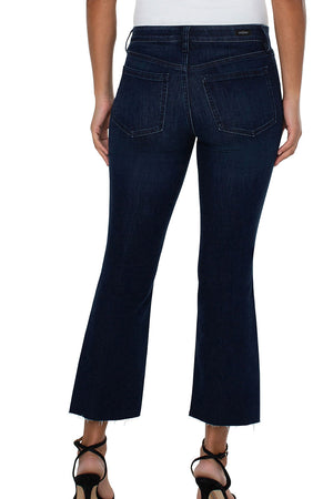 Liverpool Hannah Crop Flare with Fray Hem Walcott Wash. Dark blue wash. Mid rise jean with button & zipper closure. 5 pocket jean styling. Slim to knee, flares out to frayed hem. 25 1/2" inseam._34578316361928