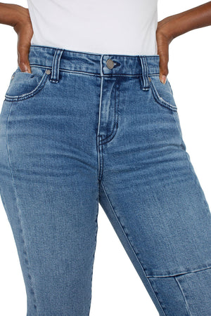 Liverpool Hannah Double Hem Crop Flair in Tremont, a medium blue wash.  Mid rise 5 pocket jean with patchwork detail and a double hem.  Set in waistband with belt loops.  Button and zipper closure.  Flare leg.  25 1/2" inseam._60562165006702