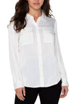 Liverpool Flap Pocket Blouse in Cream. Sateen button down with pointed collar. 2 front flap pockets. Shirt tail hem. Back yoke. Relaxed fit._t_34625631060168