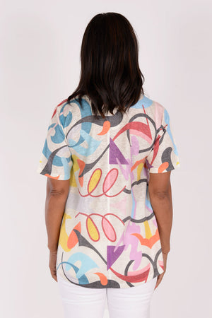 Atelier 5 Scoop Neck Top in Multi Doodle. Abstract multi colored doodle print on a cream background. Short sleeve scoop neck top with a line shape. Fused seams. High low hem. A line shape._34245528977608