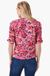 NIC+ZOE Blur Floral Ruched Top in Pink Multi. Blurred abstract floral. Slub cotton Crew neck with split v front. Elbow length sleeve with ruched detail down center of sleeve. Classic fit._t_35085311869128