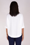Perlavera Pino Shirt in White. Popover with pointed spread collar, and hidden button placket. Short cuffed sleeves. Curved hem. One size fits many. Boxy fit._t_34324057817288