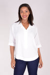 Perlavera Pino Shirt in White. Popover with pointed spread collar, and hidden button placket. Short cuffed sleeves. Curved hem. One size fits many. Boxy fit._t_34324057882824
