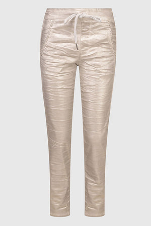 Alembika Gold Iconic Stretch Jeans.  Metallic luster fabric.  Mid rise with drawstring.  Faux fly.  Front angled pockets. Back yoke with patch pockets.  Straight, slightly tapered leg.  _34779693023432