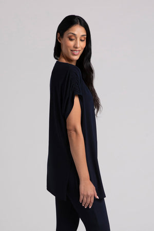 Sympli Revelry Ruched Shoulder Tunic in Navy. Crew neck dolman short sleeve top with ruched shoulder. Side slits. Tunic length. Relaxed fit._35035549794504