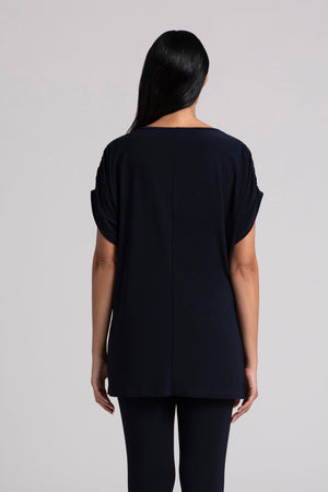 Sympli Revelry Ruched Shoulder Tunic in Navy. Crew neck dolman short sleeve top with ruched shoulder. Side slits. Tunic length. Relaxed fit._35035549761736
