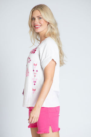 APNY Short Sleeve Embroidered Top in White with pink embroidery on front and placket. Crew neck with split v and tassel tie. Short sleeves. Straight hem. Relaxed fit._35228885844168