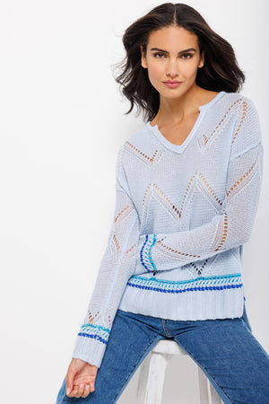 Lisa Todd Summer Softie Sweater in Ice blue.  Crew neck with notched vee. Pointelle stitched cashmere sweater with hand stitched stripes in shades of blue above hem and cuff.  Rib trim.  Side slits. High low hem.  Relaxed fit._34918715195592