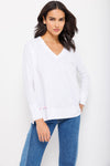 Lisa Todd Beach Tee in White. V neck tee with raglan long sleeve. Banded cuff. Banded hem with side slits. Multi colored hand stitch detail in front. Relaxed fit._t_35222810722504