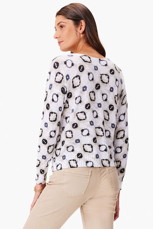NIC+ZOE Night & Day Sweater in White Multi. Whimsical shapes in black and beige on a white background. Crew neck long sleeve sweater. Drop shoulder. Rolled neck trim. Rib trim at cuff and hem. Relaxed fit._35077487493320