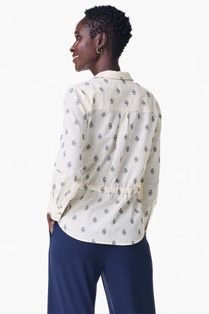 NIC+ZOE Constellation Jacket in Cream with navy miniature print. Pointed collar button down hybrid shirt jacket. Long sleeves with button cuffs. Back yoke. Shirt tail hem. Cinch tie at waist. Relaxed fit._35249431806152