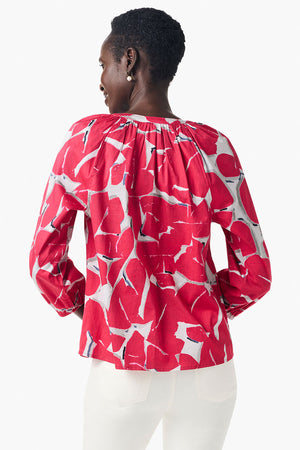 NIC+ZOE Bold Petals Shirt in Red Multi. Bold large abstract petals. Round neck notched v button down with 3/4 length raglan sleeve. Elastic cuffs. Banded neckline. Relaxed fit._35084305367240