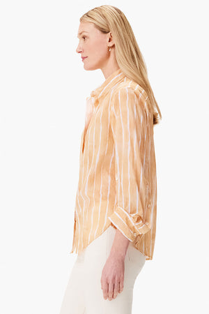 NIC+ZOE Watercolor Stripe Girlfriend Blouse in Orange Multi. Watercolor vertical stripes in white. Relaxed fit button down with long sleeves and 1 button cuffs. Pointed collar. Back yoke. Shirt tail hem._35084206014664