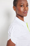 Lisa Todd Knot It Tee in White with bright yellow 1/4 zip front.  Pointed collar.  Short sleeve with knot detail. Relaxed fit._t_60257657422190