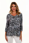Lemon Grass Reversible V neck Abstract Top in Multi. Bright colored cubist abstract print reverses to black and white splatter print. V neck, 3/4 sleeve top. Completely reversible. Relaxed fit._t_35061649539272
