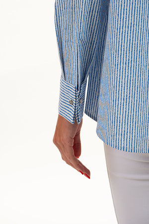 Lemon Grass Striped Blouse in Blue with White Stripes. Pointed collar button down with hammered silver buttons. Long sleeves with double cuffs and silver twist cufflinks. 2 front diagonal welt pockets. Back yoke. Side slits. A line shape. Relaxed fit._35045089804488