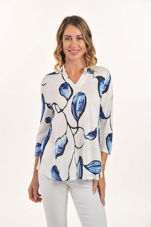 Lemon Grass Hi V Neck Printed Top in Blue. Stylized leaf  print in shades of blue, with black stems on a white background.  High banded v neck.  3/4 sleeve with button and loop closure.  2 front slits.  Curved hem.  Relaxed fit._60028196520302
