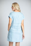 APNY Denim Grommet Dress in Blue. Tencel denim a line dress. Crew neck with cap sleeve. Inset panels at waist and hip. Grommet detail on waist panel. In seam pockets. Fringe trim at neck and sleeves. Side slits. Relaxed fit._t_35229010755784