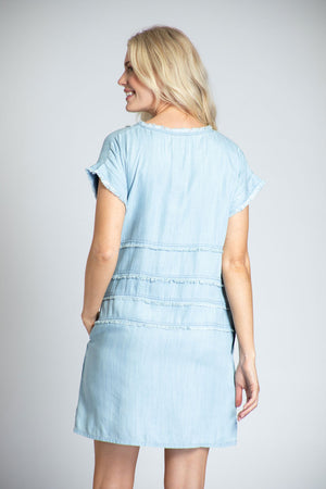 APNY Denim Grommet Dress in Blue. Tencel denim a line dress. Crew neck with cap sleeve. Inset panels at waist and hip. Grommet detail on waist panel. In seam pockets. Fringe trim at neck and sleeves. Side slits. Relaxed fit._35229010755784