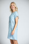 APNY Denim Grommet Dress in Blue. Tencel denim a line dress. Crew neck with cap sleeve. Inset panels at waist and hip. Grommet detail on waist panel. In seam pockets. Fringe trim at neck and sleeves. Side slits. Relaxed fit._t_35229010821320