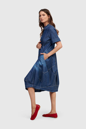 Alembika Denim Cocoon Dress.  Denim dress with full button placket and foldover collar.  3/4 sleeves   Pouf skirt. 2 side pockets.  Slim fit._60102108578158